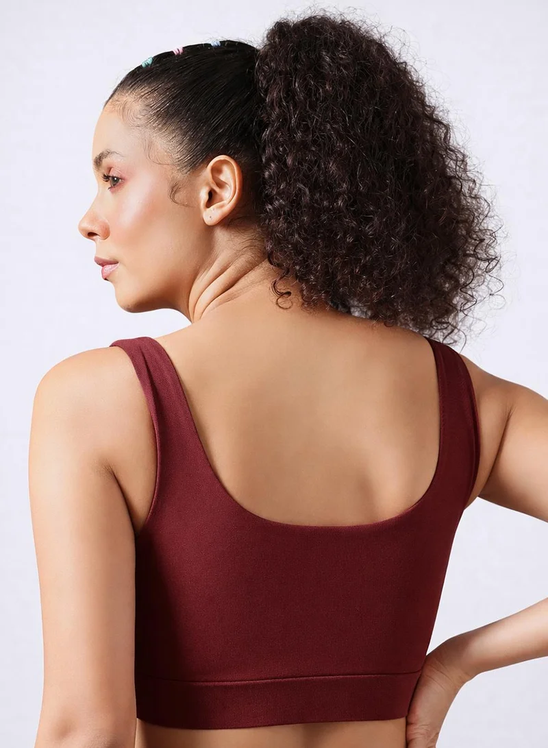 Clovia Red Medium Impact Sports Bra in Maroon with Removable Cups for Women | Best Price UAE